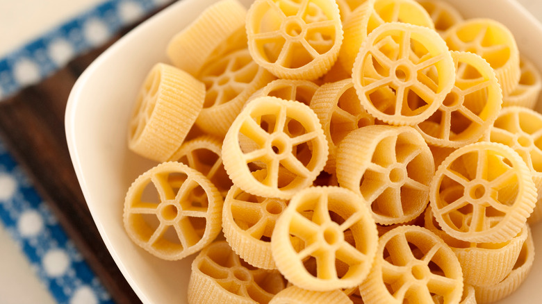 Yellow pasta shaped like wheels