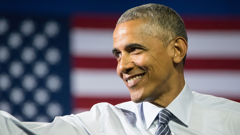 President Obama with flag behind him