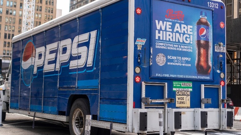 Pepsi truck parked on a street