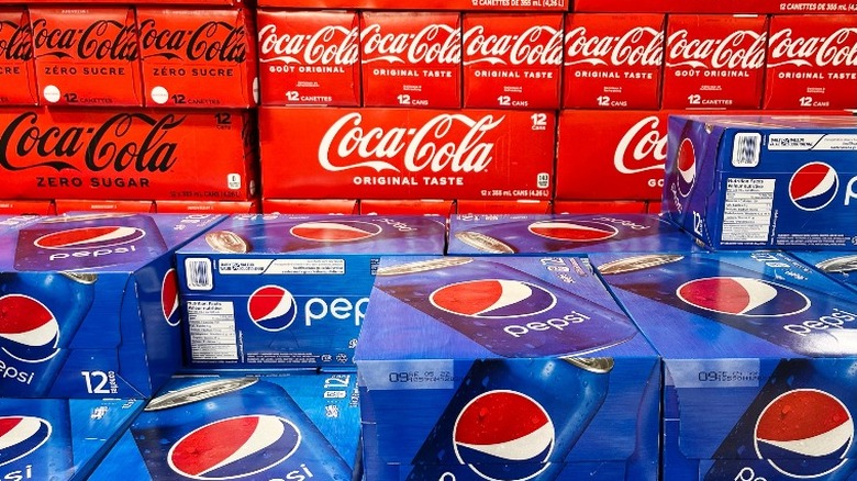 stacked Pepsi and Coke boxes