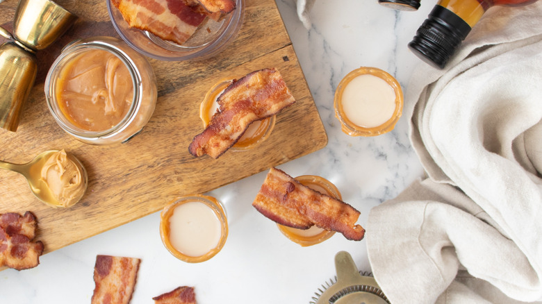 bacon, peanut butter, and shot glasses topped with bacon strips