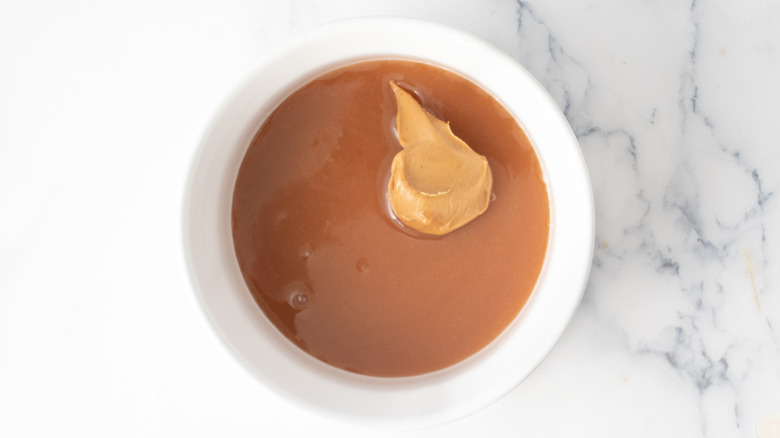 caramel sauce with a blob of peanut butter