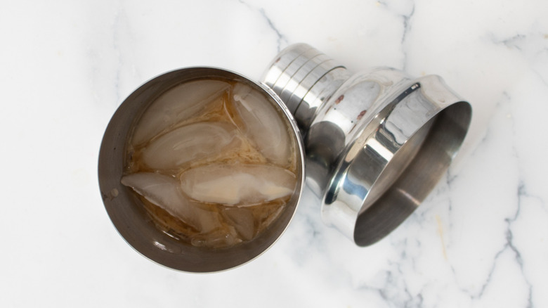 cocktail shaker with ice and liquid