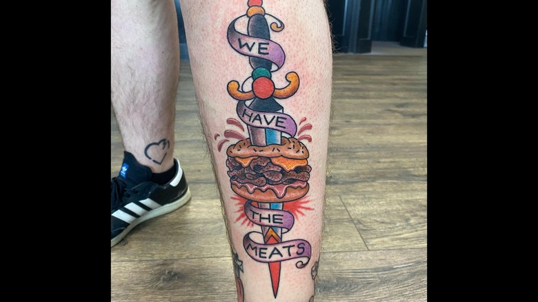 Arby's themed tattoo on person's leg 