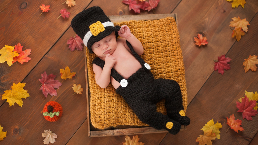 Thanksgiving-costumed baby taking a nap