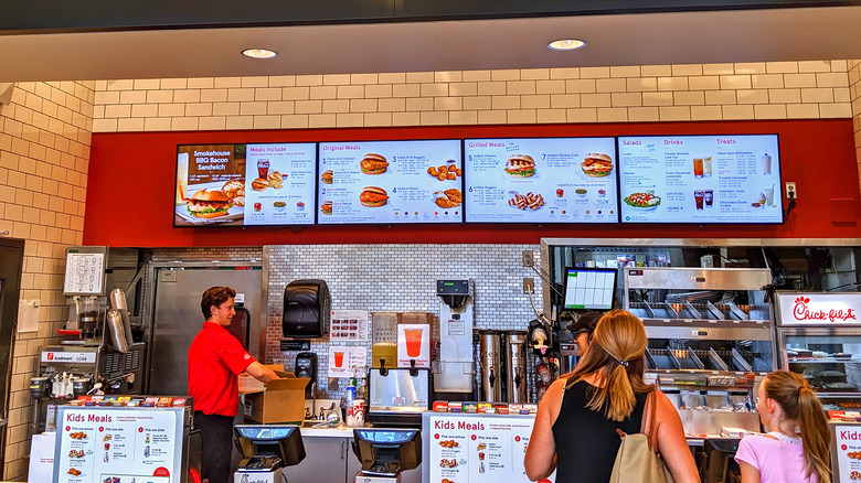 Chick-fil-A cashier and menu