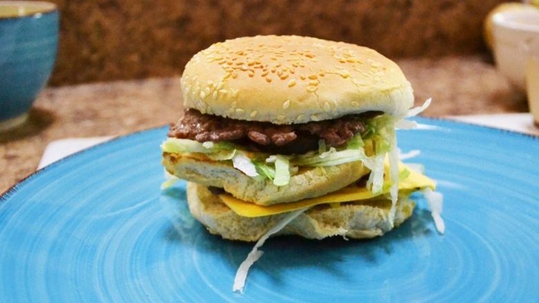 cheeseburger on blue plate