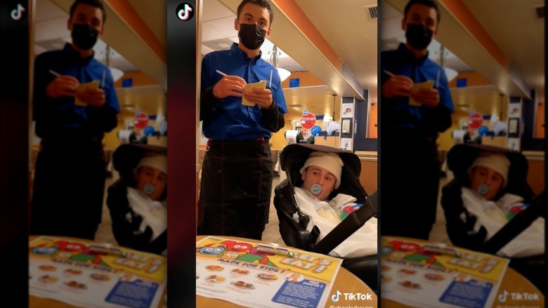 Boy disguised as baby at IHOP