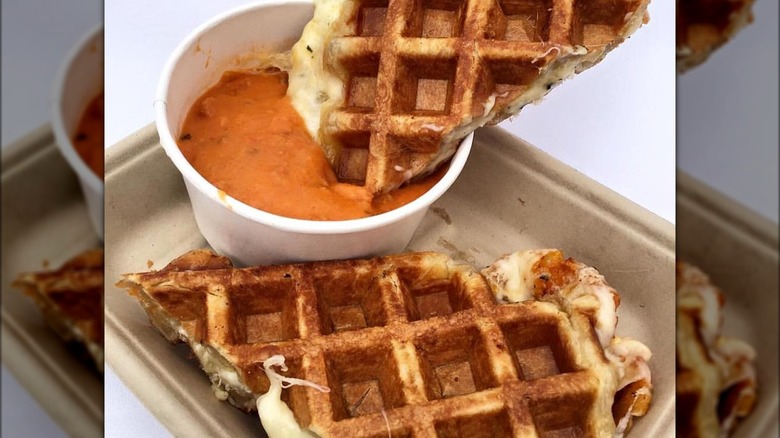 grilled cheese waffle dipped in tomato soup