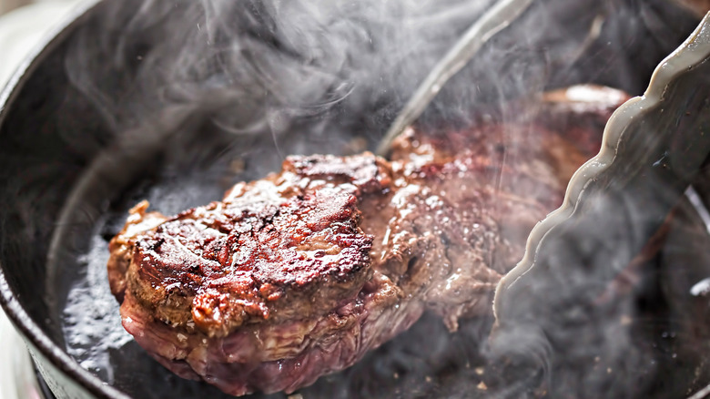 Steak searing in cast iron pan