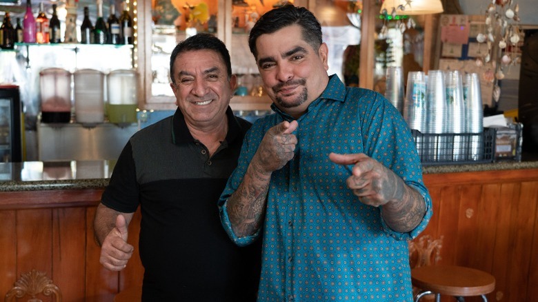 Aarón Sanchez with restaurant owner