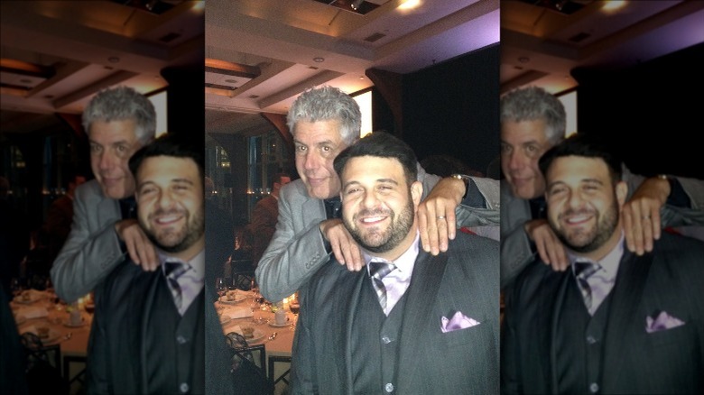 Adam Richman and Anthony Bourdain smiling