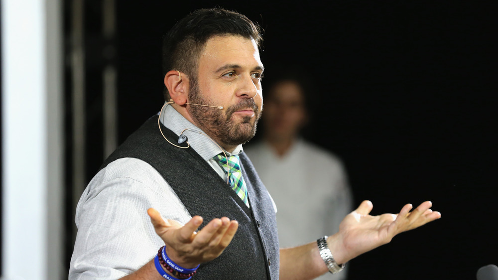 Adam Richman giving talk on stage