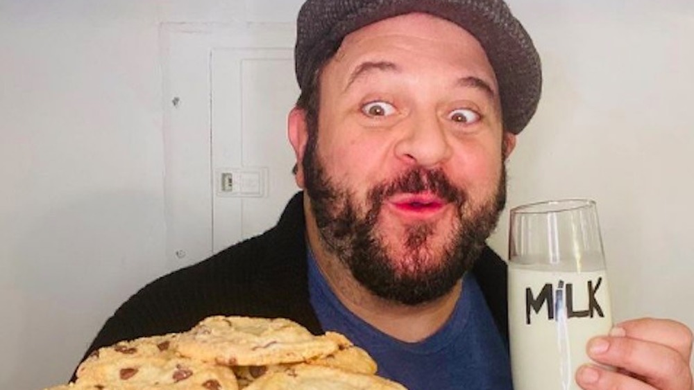 Adam Richman with cookies and milk