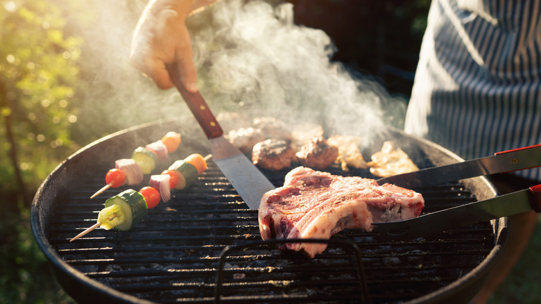 Person grilling outdoors