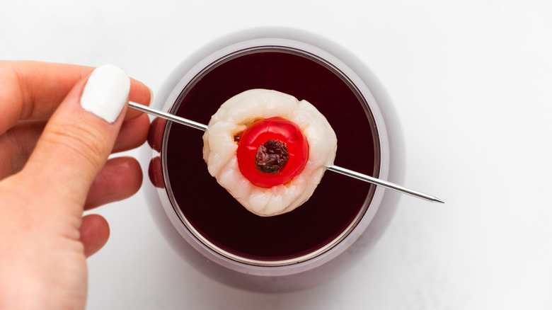 cocktail with edible eyeball garnish