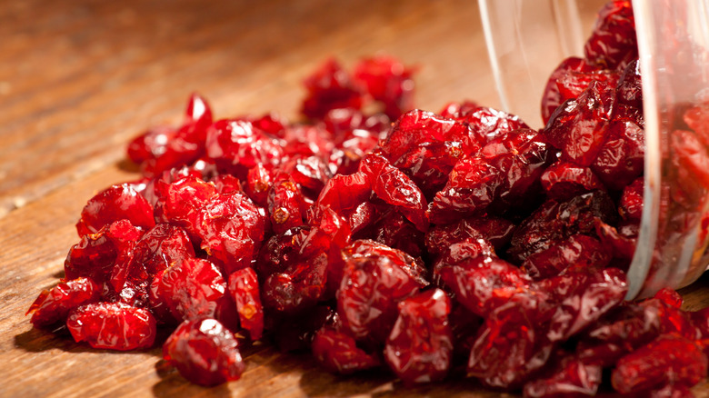 Dried cranberries with wood background