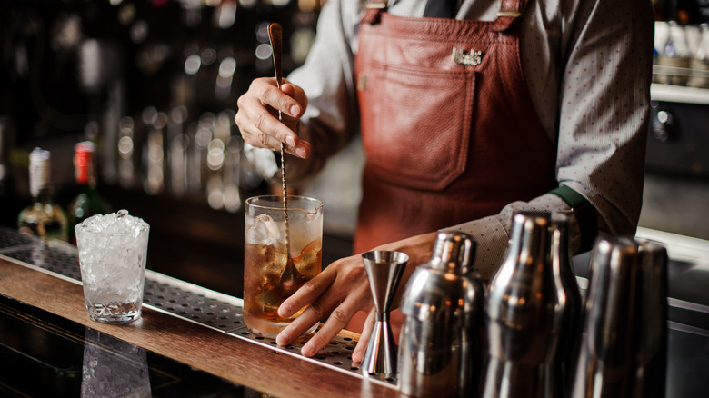 Person mixing drink