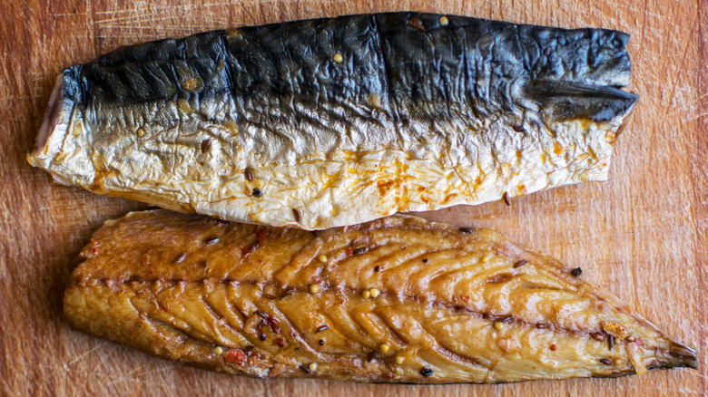 Smoked Kipper and Mackerel on a wooden surface