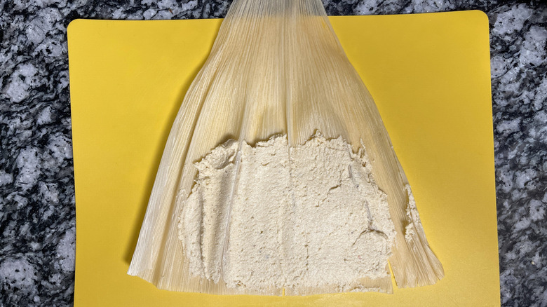 Masa spread onto corn husk