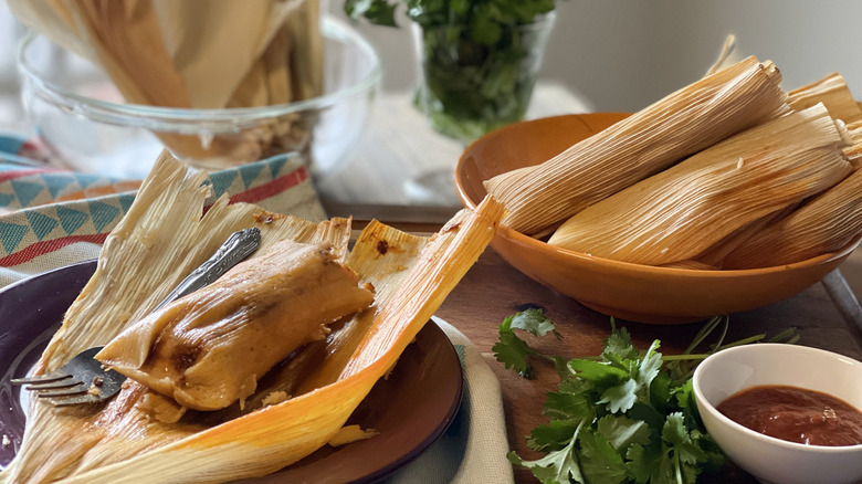 Chile and cheese tamale on plate and in bowl