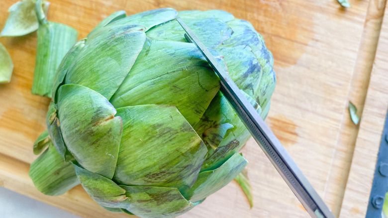 artichoke on cutting board 