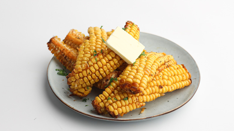 corn on plate with butter 