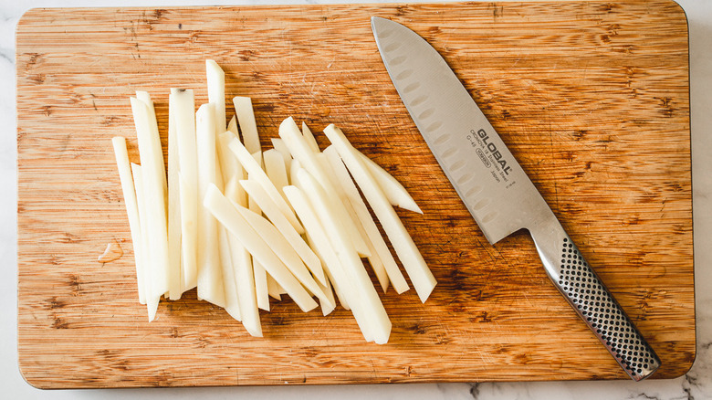 potatoes cut on cutting board