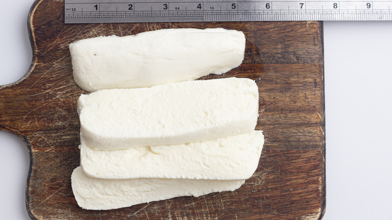 Slicing the mozzarella for the Air Fryer Mozzarella Sticks