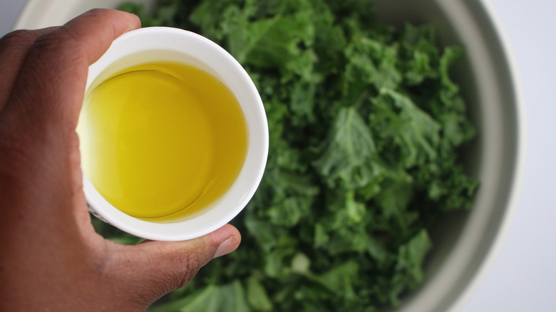 olive oil poured over kale