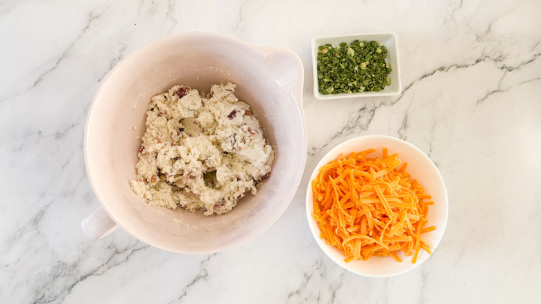 mashed potatoes, cheese, and chives