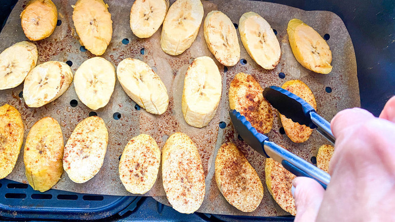 flipping plantain slices