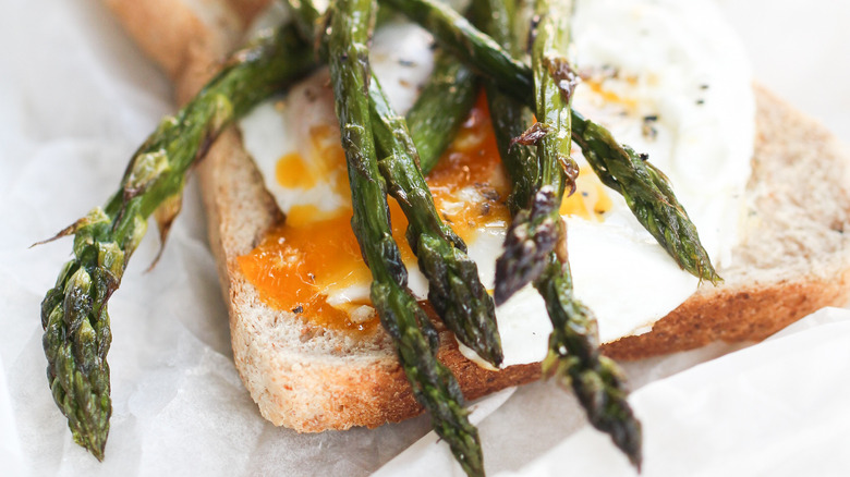 asparagus on eggs and toast