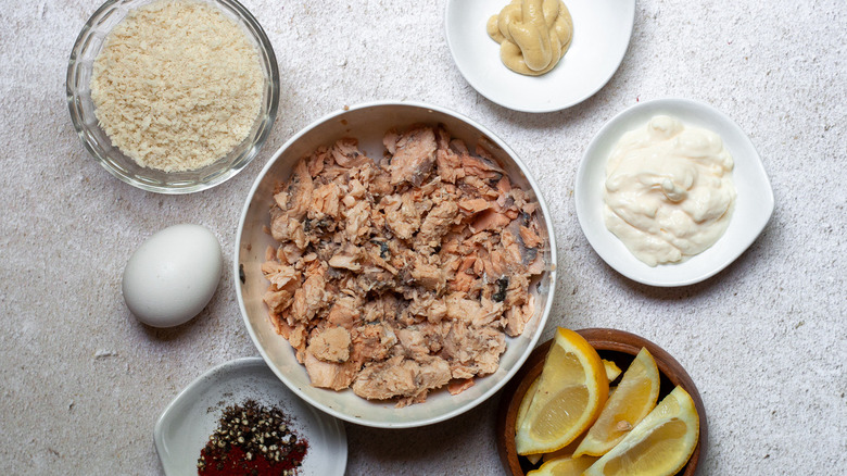 Canned salmon and other patty Ingredients sitting on a table