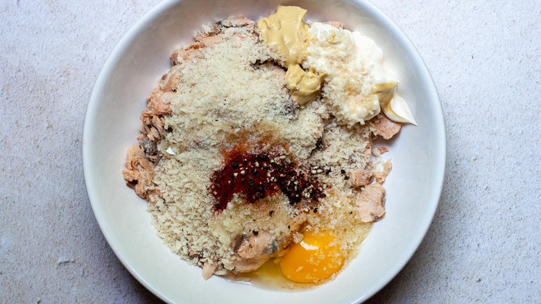 Salmon patty ingredients in a large bowl