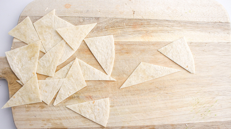 tortilla triangles on cutting board
