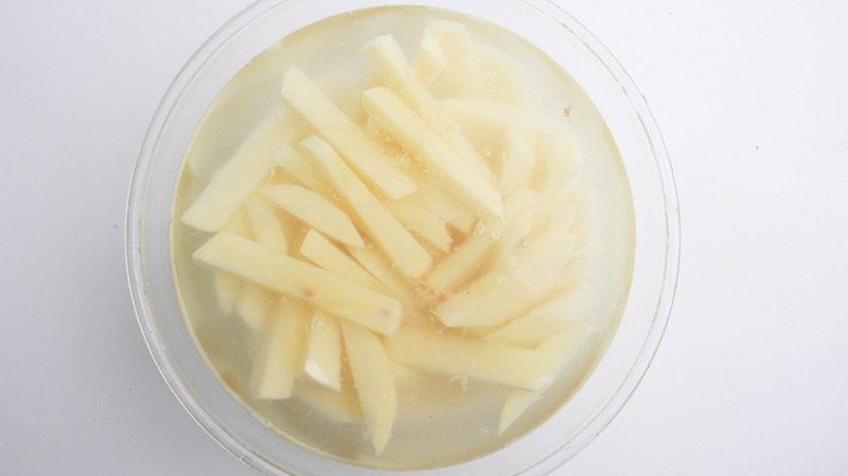 potatoes soaking in a bowl