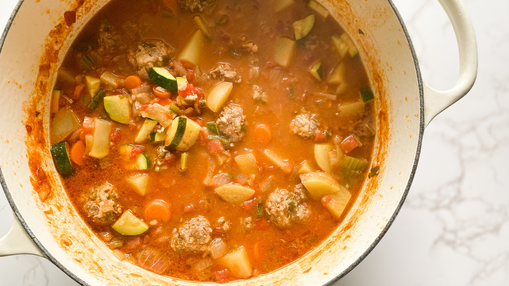 simmering  albondigas soup with homemade meatballs and veggies