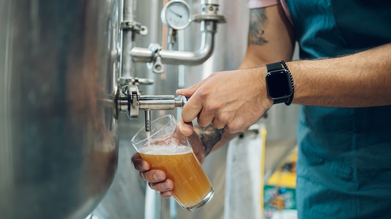 Man pouring a draft beer