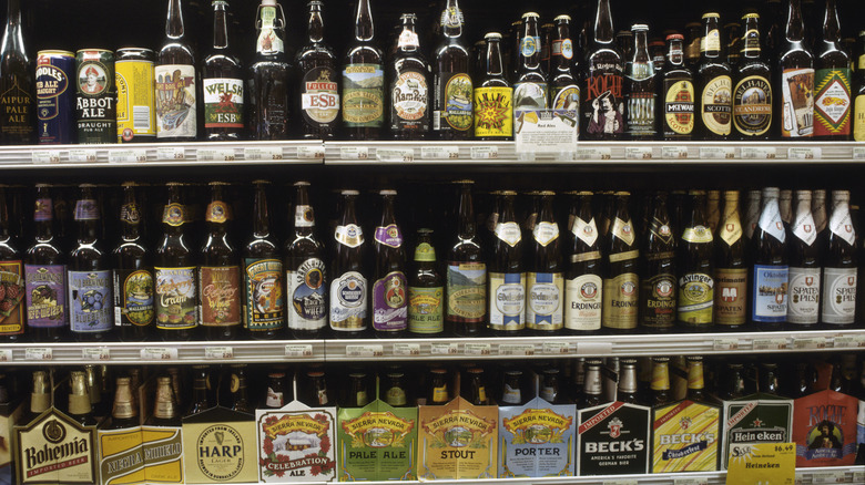 Shelves stocked with various beers