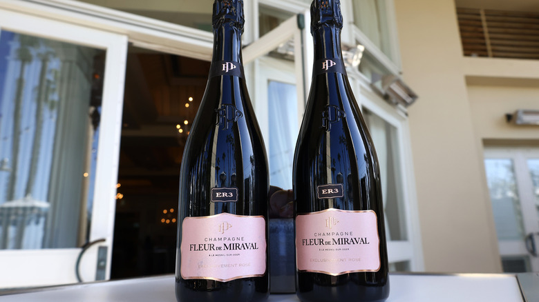 Pair of champagne bottles on table