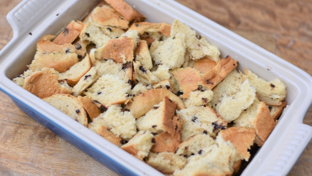 torn chocolate chip bread in enameled baking pan