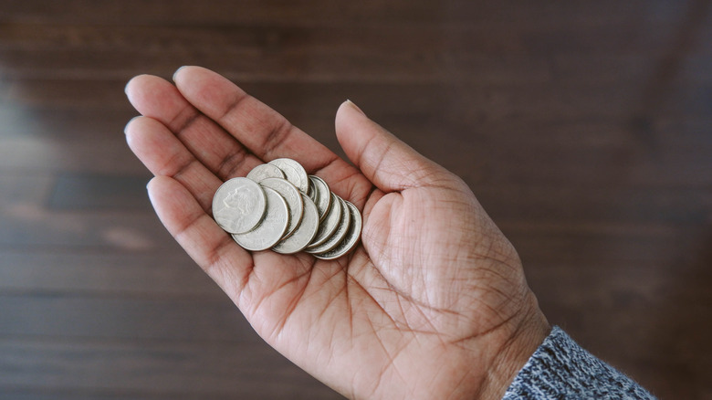 woman holding change