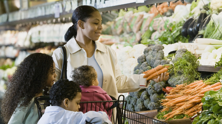 family with cart grocery shopping