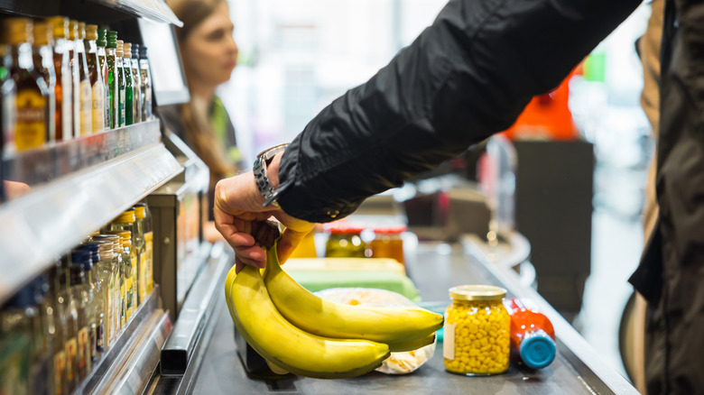 person checkng out in grocery store