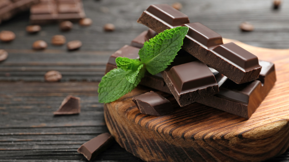 Mint and chocolate on wooden table