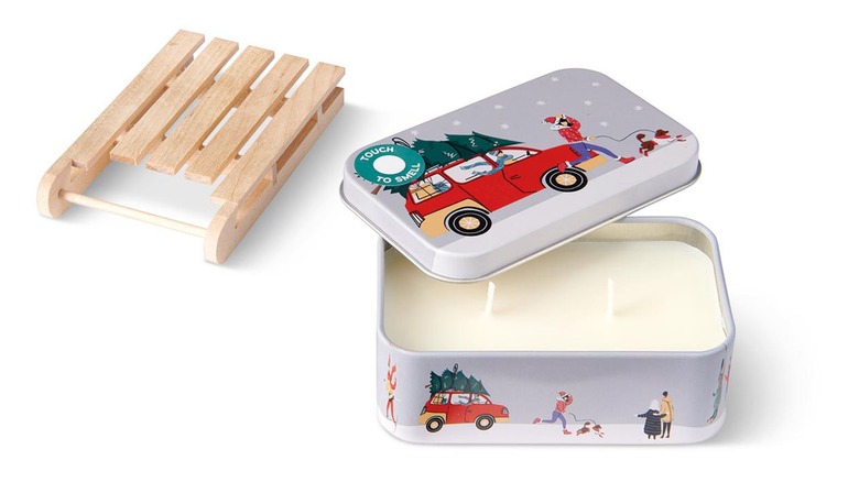 Rectangular tin candle with small wooden sleigh