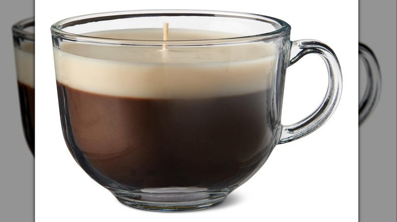 brown candle in mug-shaped glass