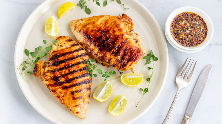 Prepared chicken fillets on white plate