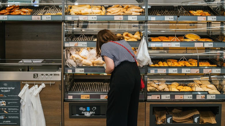 customer shopping for bread